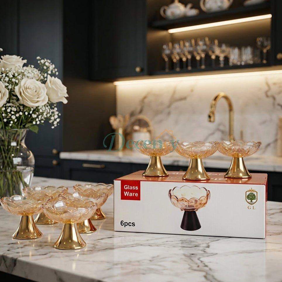 6-piece amber glass dessert bowls with shiny gold pedestal bases set on packaging box
