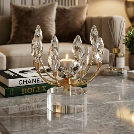 Crystal lotus candle holder with gold metal arms and clear faceted leaf crystals on a round acrylic base.