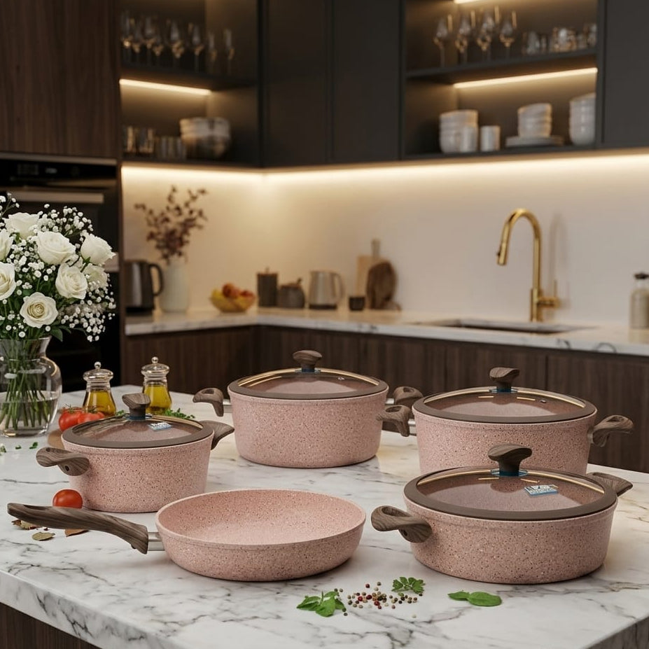 Falez 9-piece granite non-stick cookware set displayed on kitchen counter