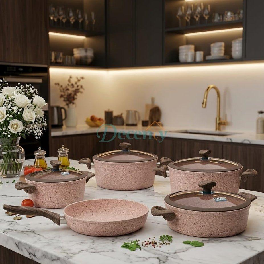 Falez 9-piece granite non-stick cookware set displayed on kitchen counter