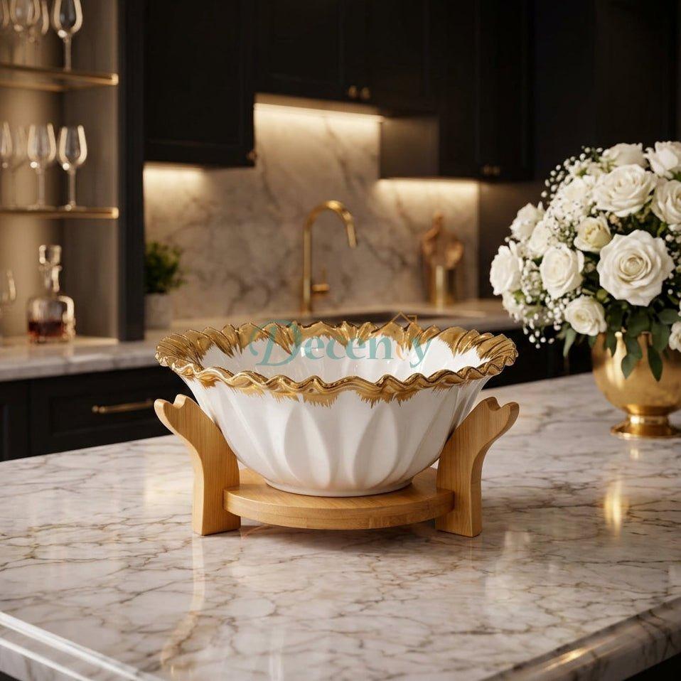 Luxury 24cm white ceramic fruit bowl with fluted gold rim on a wooden stand placed on a marble kitchen island