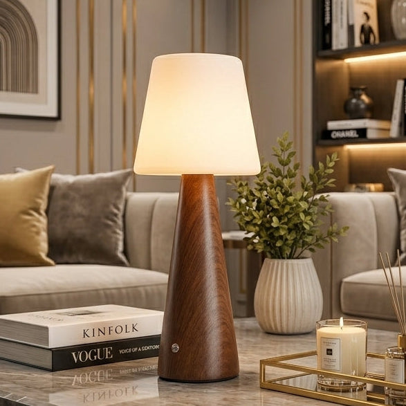 Modern rechargeable wooden touch table lamp illuminated on a coffee table in a luxury living room