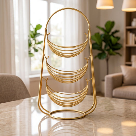Front view of a 3-tier gold metal fruit basket stand placed in a modern living room