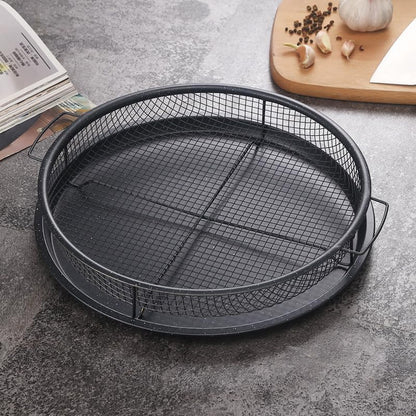 Non-stick round air fryer crisp tray and mesh basket set filled with fries and fried chicken
