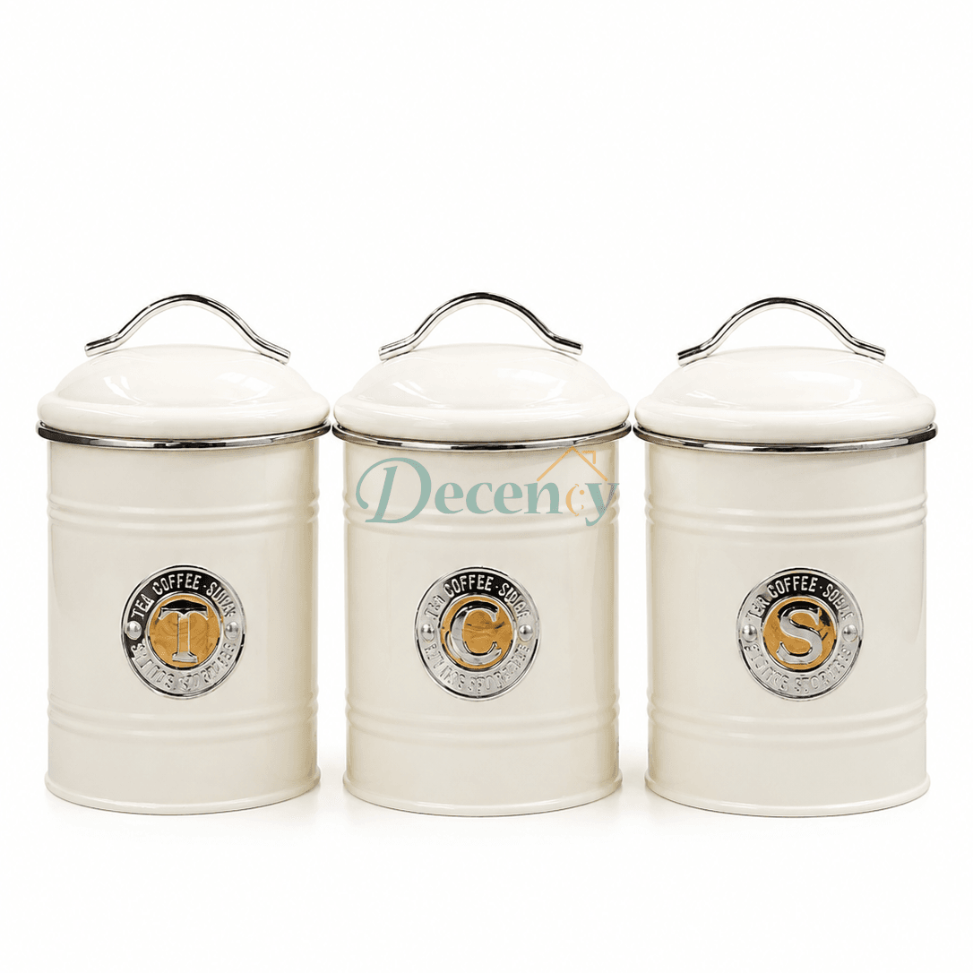 Three premium black metal kitchen storage jars arranged on a clean countertop