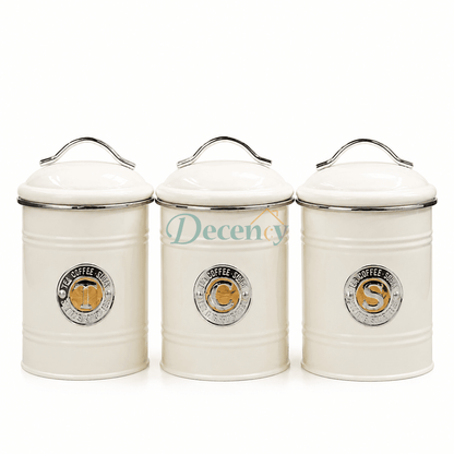 Three premium black metal kitchen storage jars arranged on a clean countertop