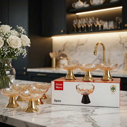 6-piece amber glass dessert bowls with shiny gold pedestal bases set on packaging box