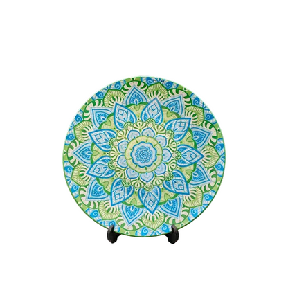Handcrafted 10-inch blue and green mandala ceramic decorative plate on display