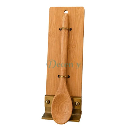 Premium bamboo wooden serving spoon resting on a modern kitchen counter in Pakistan