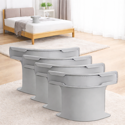 Set of four grey adjustable bed sheet holder clips displayed on a modern bedroom carpet floor