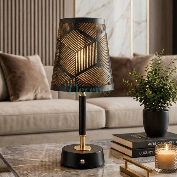 Black geometric cordless table lamp glowing on a coffee table in a modern Pakistani living room