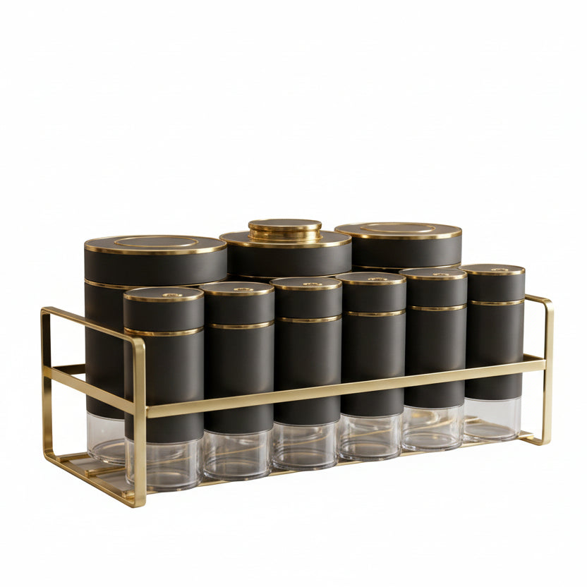 Luxury matte black and gold spice jar set with metal stand on a marble countertop