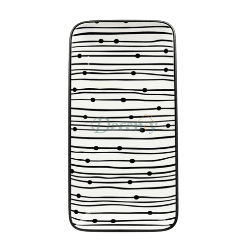 Top view of a rectangular black and white striped ceramic serving platter with graphic dot patterns against a white background