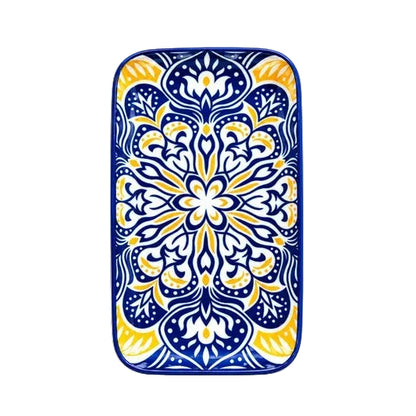 Blue and yellow Moroccan design ceramic serving tray placed on a marble coffee table in a modern living room in Pakistan
