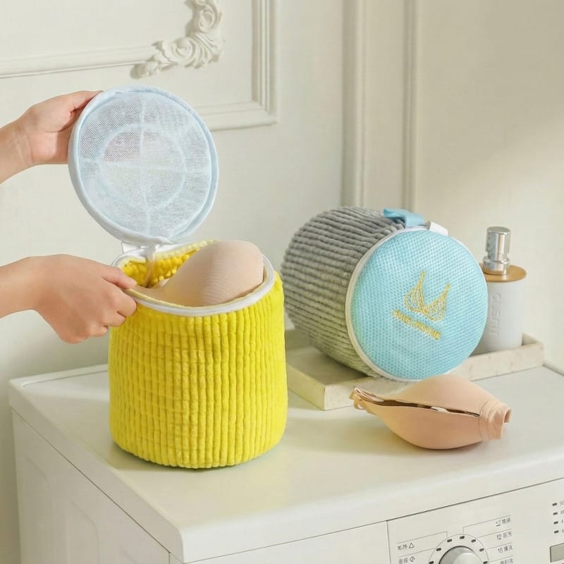 Yellow cylindrical padded bag for machine washing bras and undergarments