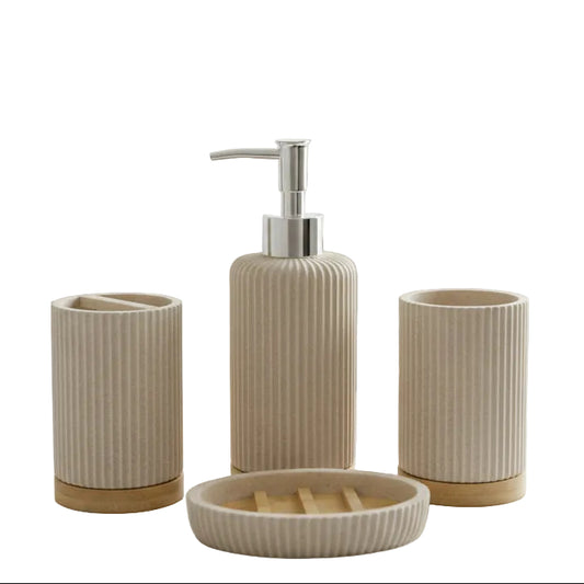Complete 4-piece fluted ceramic and bamboo bathroom accessories set arranged on a marble counter.