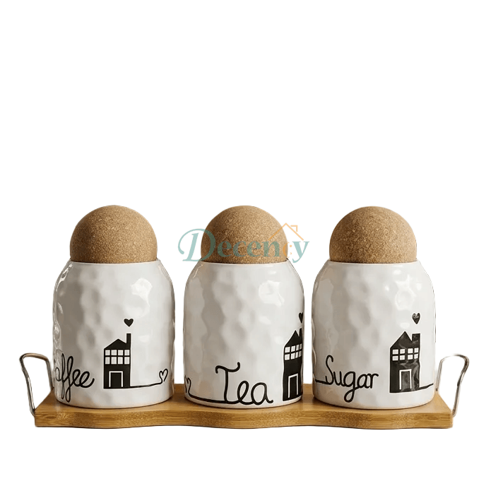 Three-piece white ceramic kitchen canister set placed neatly on a natural wooden stand on a modern kitchen countertop