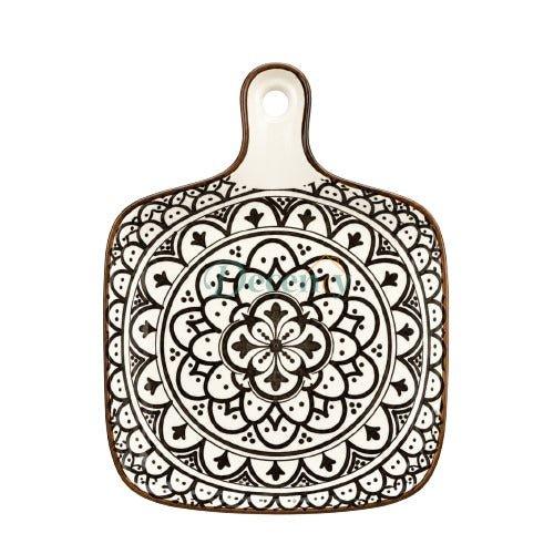 Square ceramic serving platter with handle featuring a black and white mandala pattern