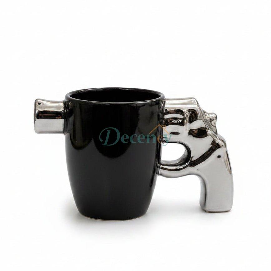 Premium ceramic revolver mug with a shiny metallic pistol grip handle on a white marble surface.