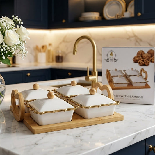 White square ceramic snack bowl set with gold rims on a bamboo tray