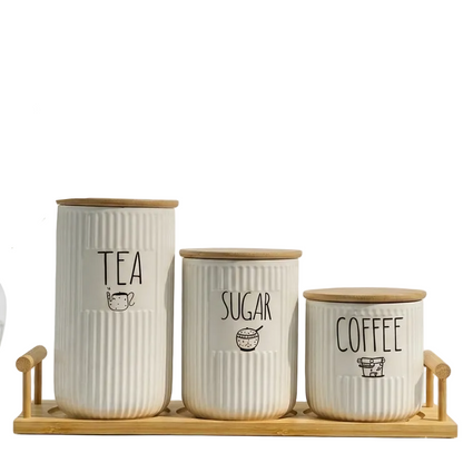 3-piece ribbed ceramic tea coffee sugar jar set placed on a wooden tray on a marble kitchen counter