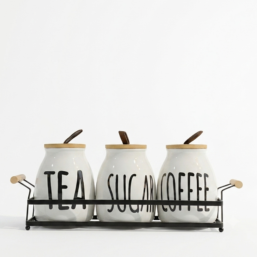 3 piece ceramic tea coffee sugar jar set arranged neatly on a sleek metal stand