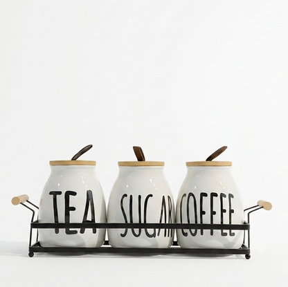 3 piece ceramic tea coffee sugar jar set arranged neatly on a sleek metal stand