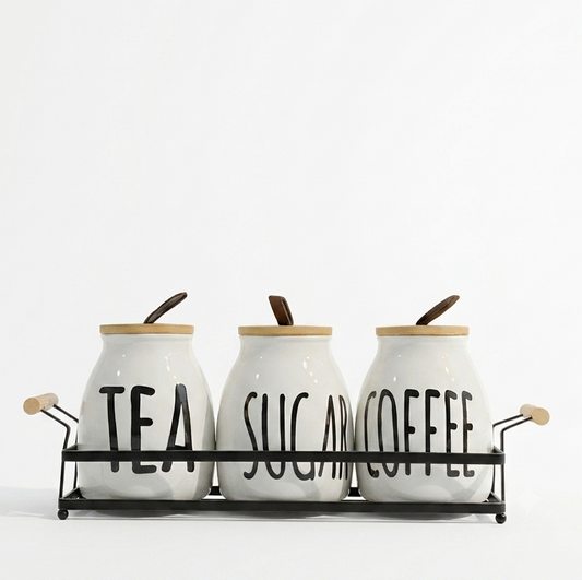 3 piece ceramic tea coffee sugar jar set arranged neatly on a sleek metal stand