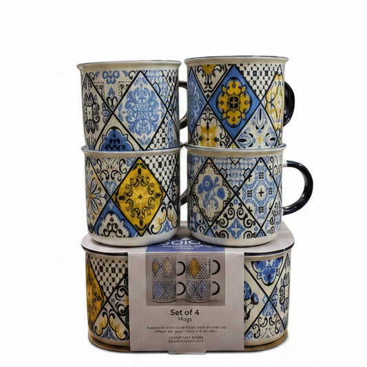 Stacked set of 4 printed ceramic tea mugs with royal blue and yellow mosaic patterns on a marble kitchen counter.