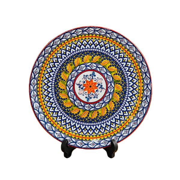 Classic ceramic serving platter with intricate mosaic design on a clean dining setup.