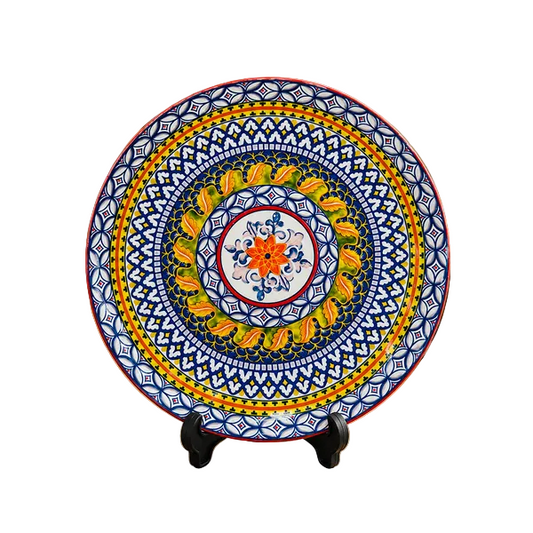 Classic ceramic serving platter with intricate mosaic design on a clean dining setup.