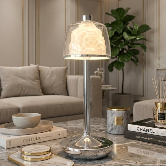 Modern Rose Dome crystal table lamp with sleek chrome base placed on a wooden coffee table