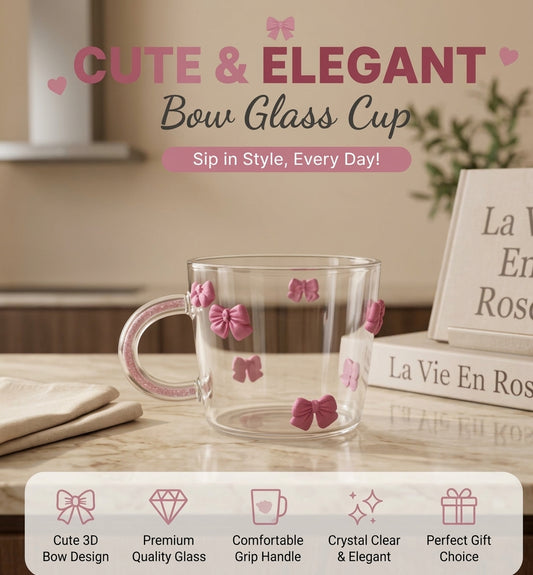 Cute 3D bow glass cup with pink ribbon bow embellishments placed on a tabletop 