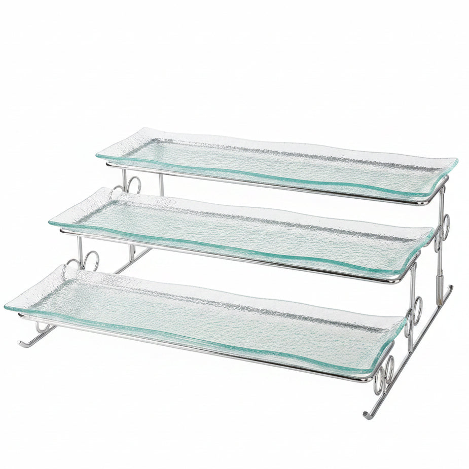 Danny Home 3-tier clear textured glass serving tray on a silver metal stand placed on a marble kitchen island.