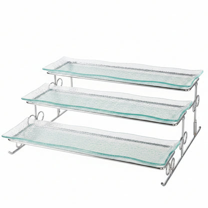 Danny Home 3-tier clear textured glass serving tray on a silver metal stand placed on a marble kitchen island.