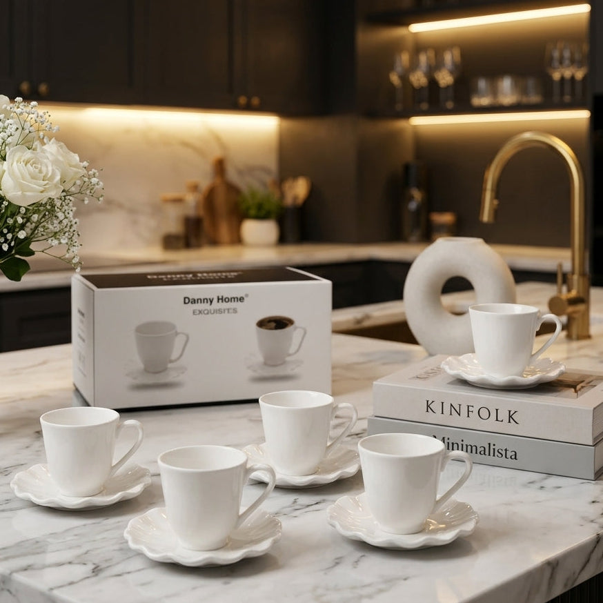 Danny Home 6-piece white ceramic 200ml cup and saucer set with scalloped edges on a marble countertop.