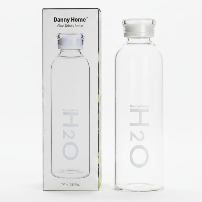 Danny Home 750ml glass water bottle placed on a modern Pakistani kitchen counter.