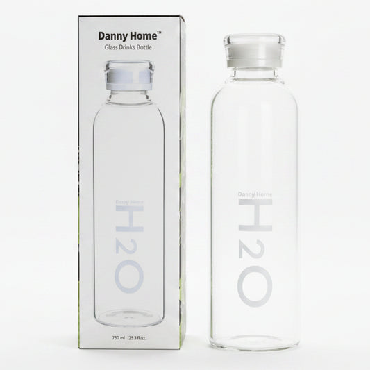 Danny Home 750ml glass water bottle placed on a modern Pakistani kitchen counter.