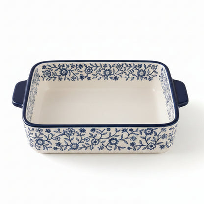 Danny Home 8 inch porcelain baking dish with blue floral pattern placed on a marble kitchen counter.