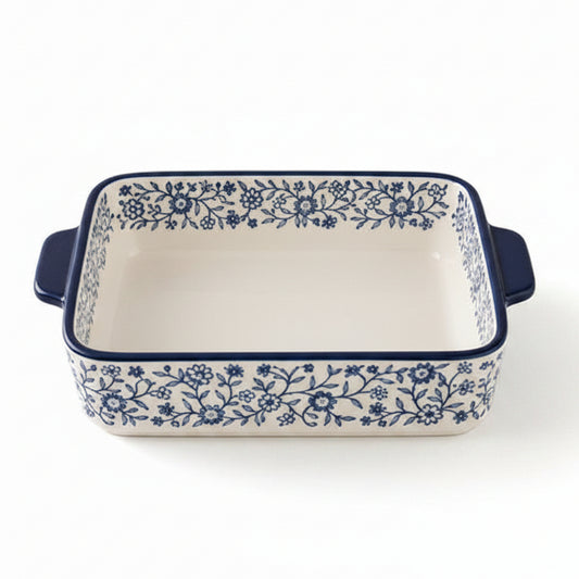 Danny Home 8 inch porcelain baking dish with blue floral pattern placed on a marble kitchen counter.