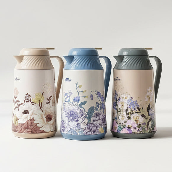 Trio of 1 litre Day Days floral vacuum flasks with glass inner refill displayed on a marble kitchen counter.