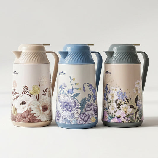 Trio of 1 litre Day Days floral vacuum flasks with glass inner refill displayed on a marble kitchen counter.