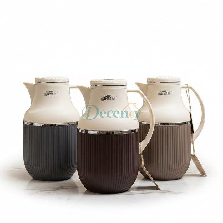 Three Day Days 1 litre vacuum flasks lined up on a marble kitchen counter in grey, dark brown, and taupe
