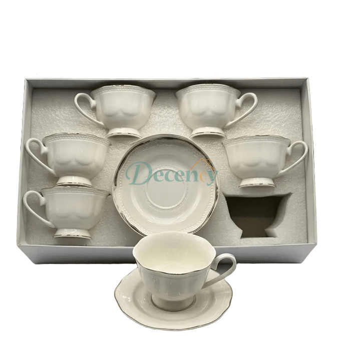 Elegant 6-piece tea cups and saucers set featuring a detailed embossed design and a classic silver rim.