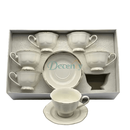 Elegant 6-piece tea cups and saucers set featuring a detailed embossed design and a classic silver rim.
