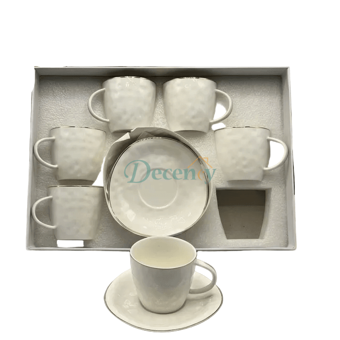 Luxury white porcelain tea cup and saucer set with textured finish and elegant gold rim details.