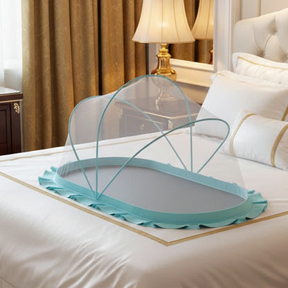 Foldable light blue baby mosquito net set up inside a wooden baby crib