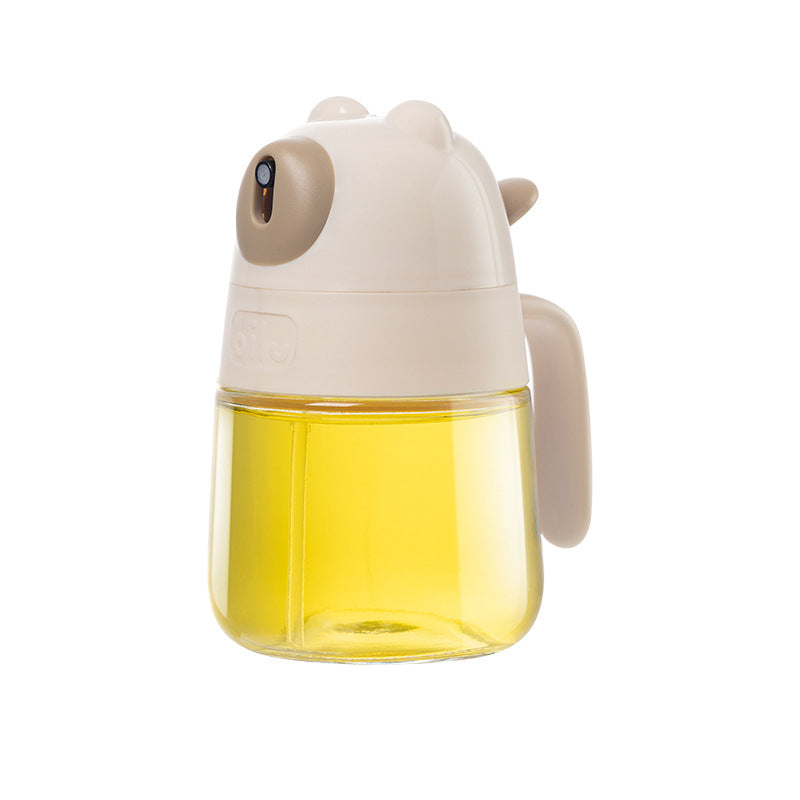 Clear 300ml glass oil bottle container with leak-proof pouring cap on a kitchen counter