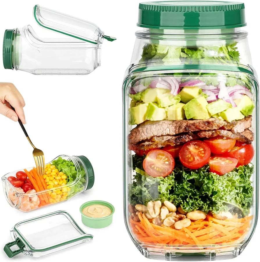 Clear glass salad jar with airtight lid filled with fresh salad and vegetables.