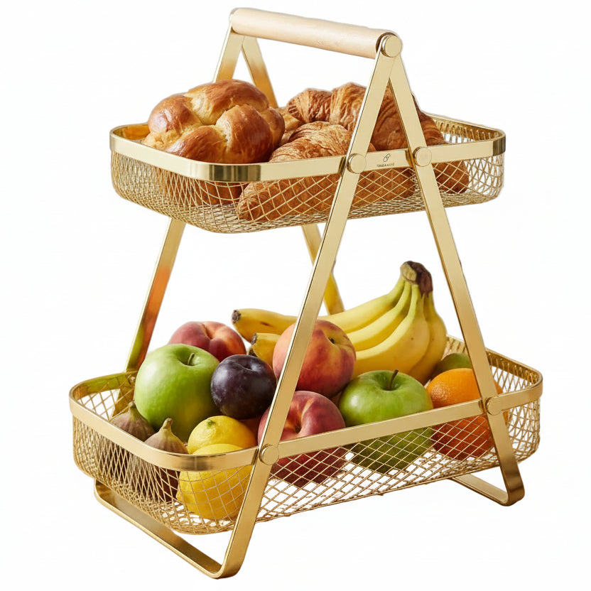2-tier gold wire mesh fruit and bread basket sitting on a modern kitchen countertop